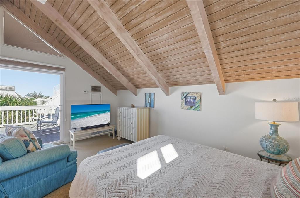 5000 Gasparilla Road, Unit 16 Boca Grande, FL 33921 - Photo 23 of 46 a bed room with a bed window and a couch