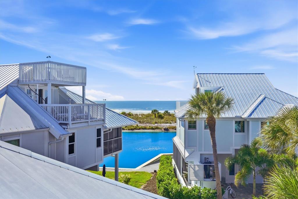 5000 Gasparilla Road, Unit 16 Boca Grande, FL 33921 - Photo 27 of 46 a front view of a house with a yard