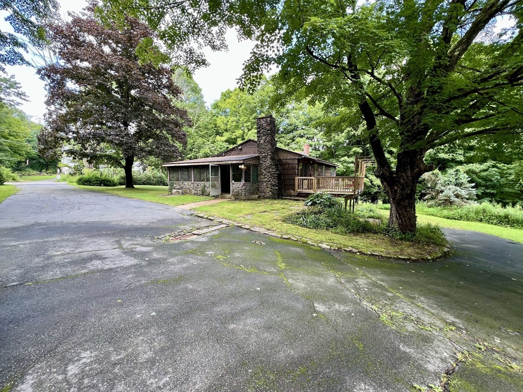 7 Shepard Place Sturbridge, MA 01566 - Photo 1 of 34 a view of a house with a yard and large tree