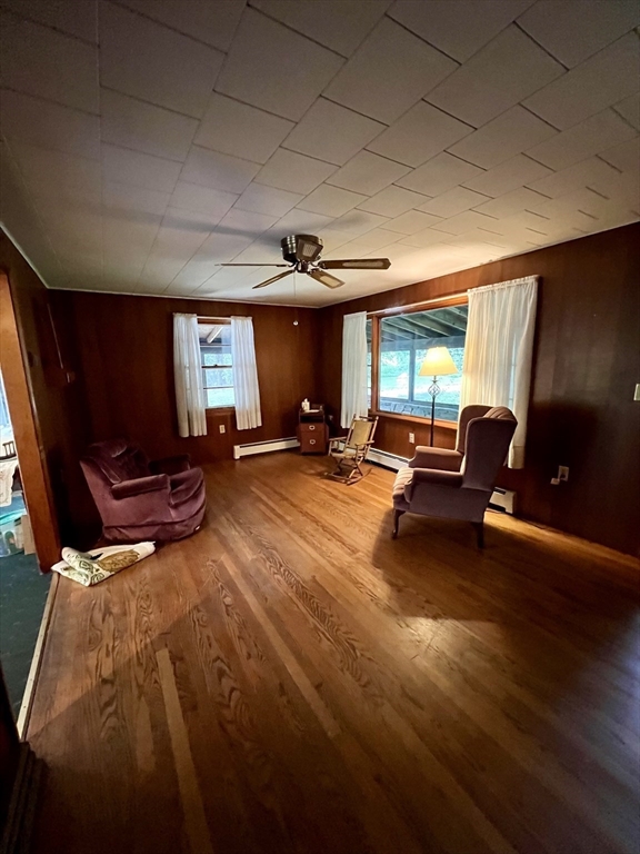 7 Shepard Place Sturbridge, MA 01566 - Photo 12 of 34 a living room with furniture gym equipment and a large window