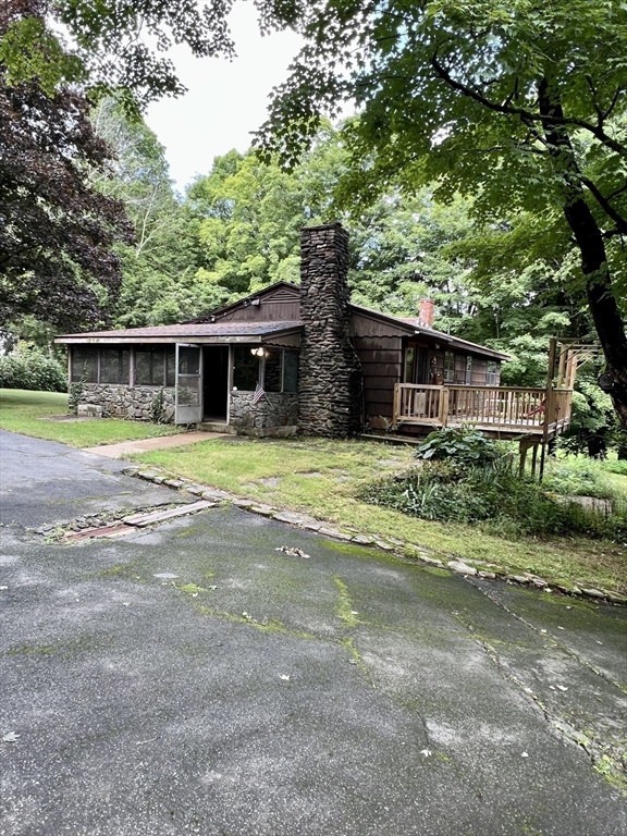 7 Shepard Place Sturbridge, MA 01566 - Photo 2 of 34 a view of a house with a yard and sitting area