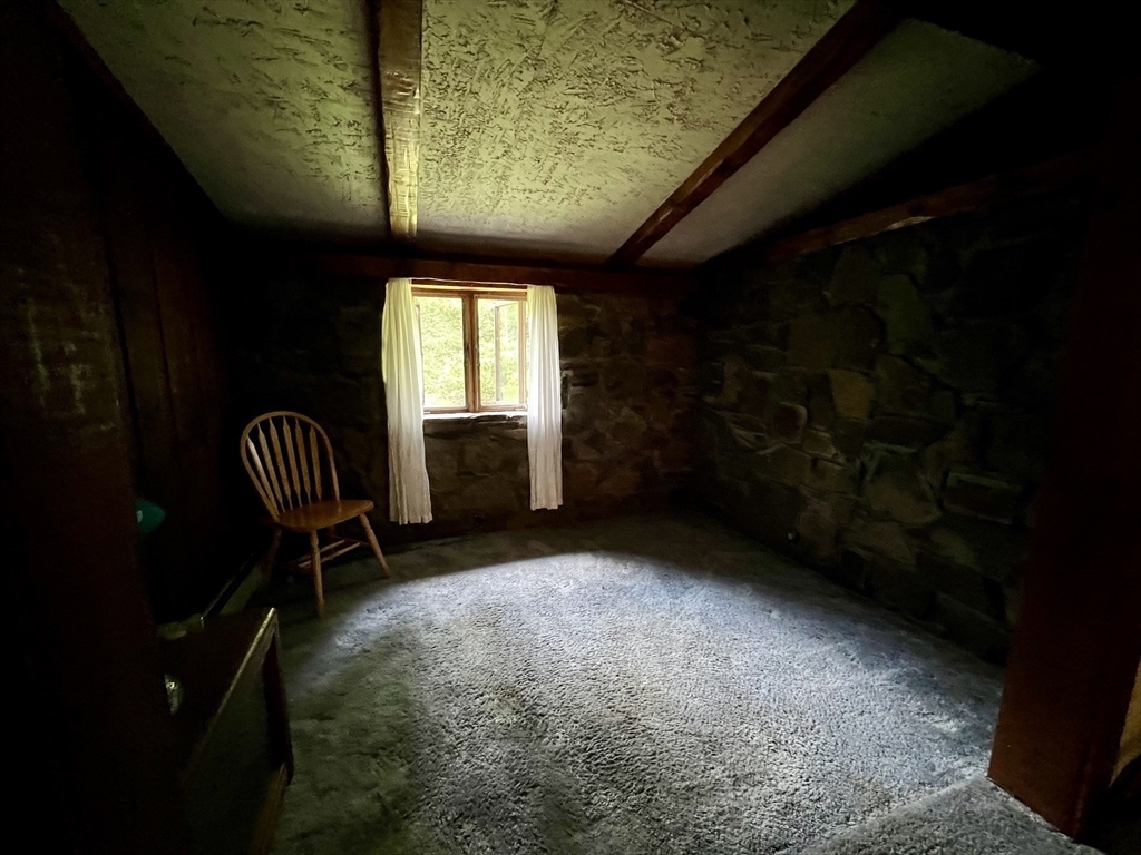 7 Shepard Place Sturbridge, MA 01566 - Photo 21 of 34 a living room with furniture and a chair