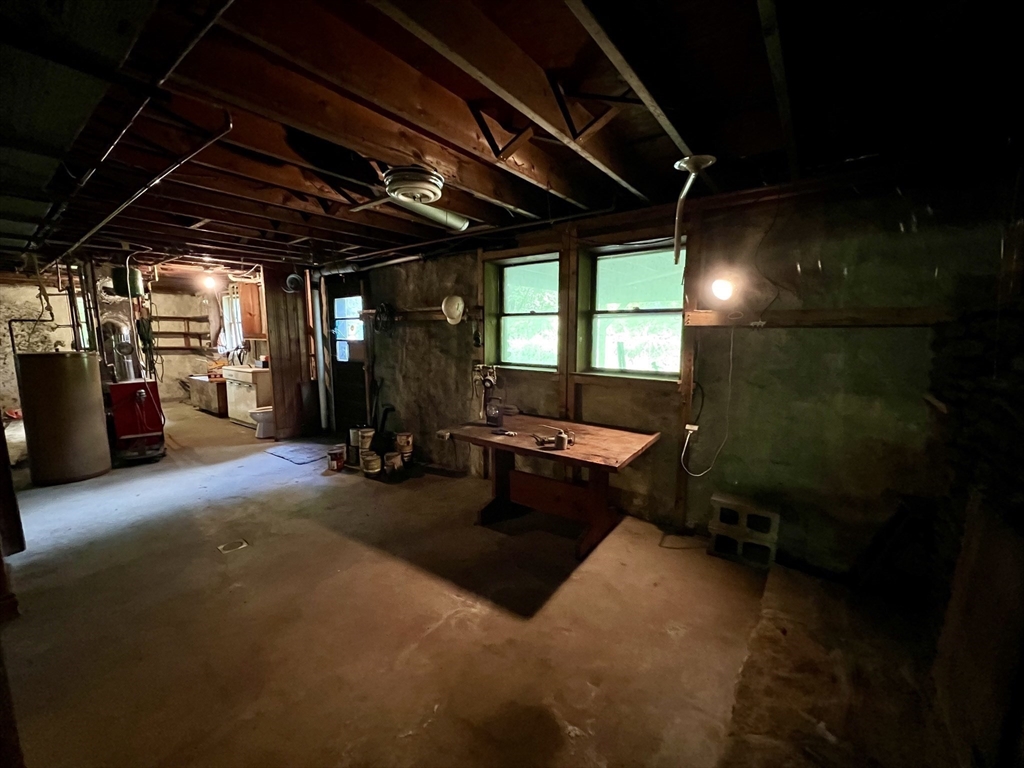 7 Shepard Place Sturbridge, MA 01566 - Photo 24 of 34 a room with lots of furniture and a water heater