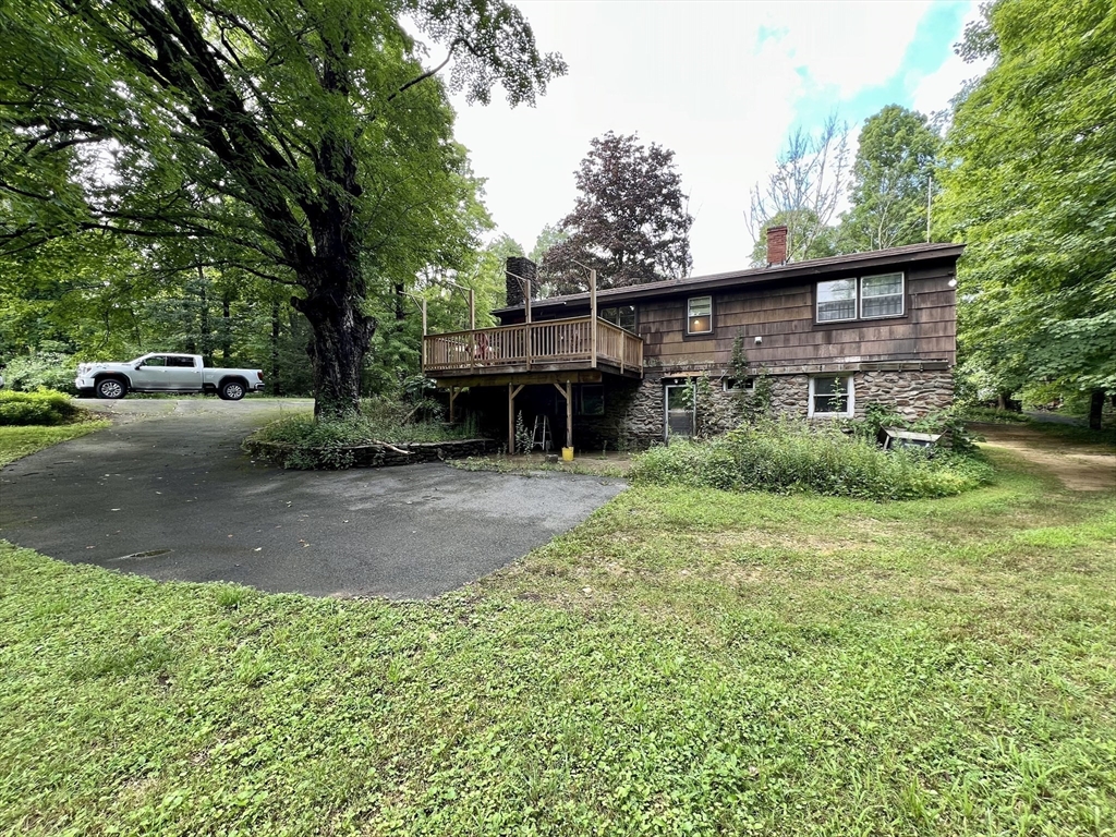 7 Shepard Place Sturbridge, MA 01566 - Photo 6 of 34 a view of a house with backyard and a tree