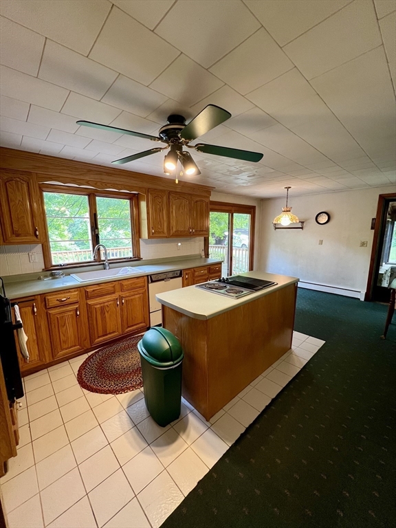 7 Shepard Place Sturbridge, MA 01566 - Photo 8 of 34 a kitchen with a sink a counter top space and a view of living room