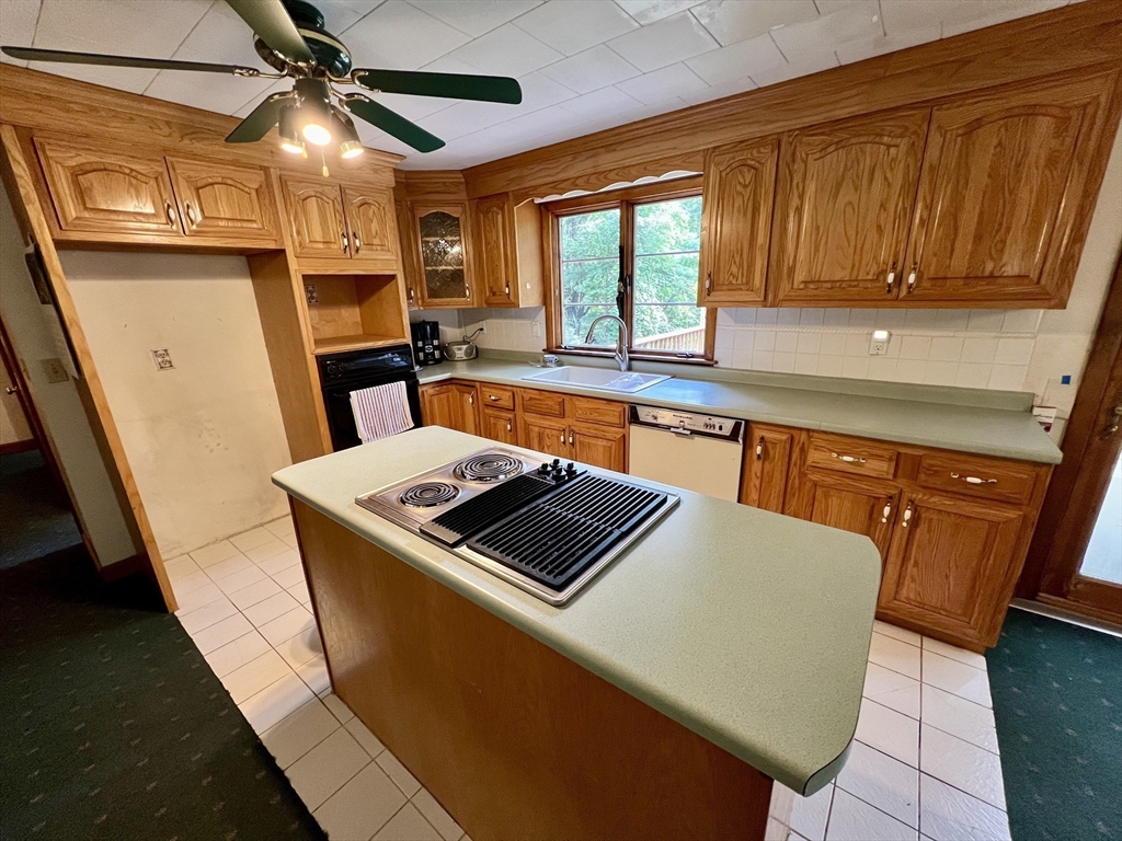7 Shepard Place Sturbridge, MA 01566 - Photo 9 of 34 a kitchen with stainless steel appliances granite countertop a stove a sink and a microwave