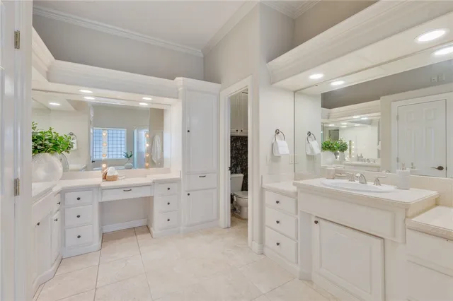 a bathroom with a sink a light fixture a vanity and a mirror