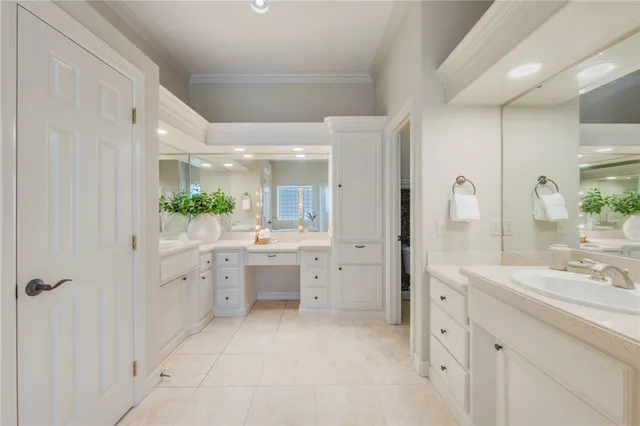 a bathroom with a granite countertop sink mirror and a bathtub