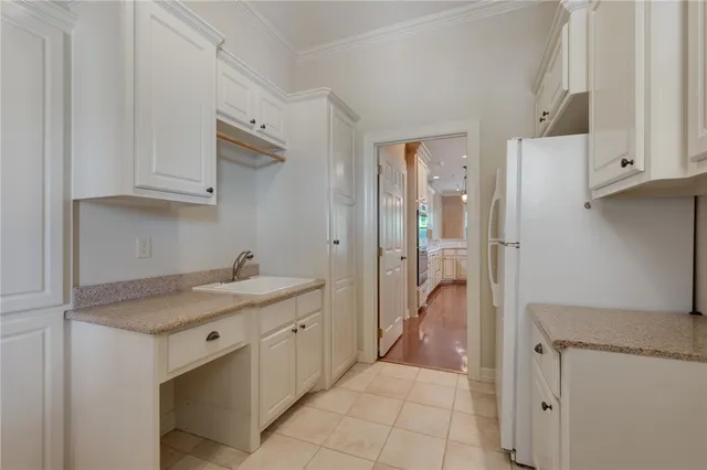 a kitchen with a sink and refrigerator