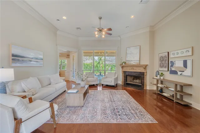 a living room with furniture fireplace and window