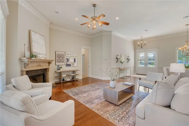 a living room with fireplace furniture and decor