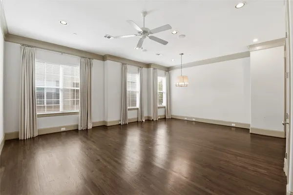 a living room with furniture and flowers