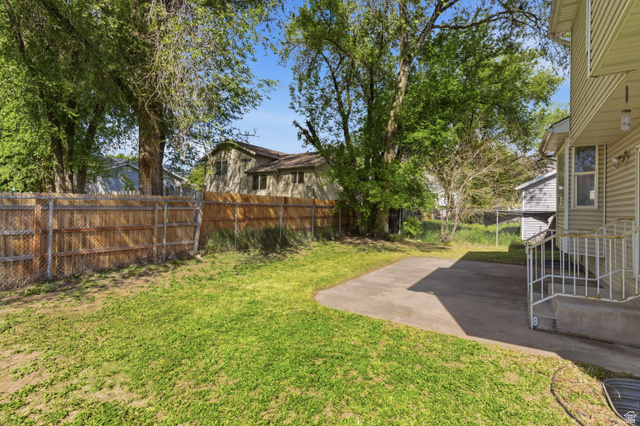 134 West 475 South Ogden, UT 84404 - Photo 23 of 27 Fenced backyard with a patio area