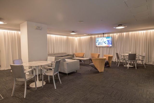 a view of a livingroom with furniture and window
