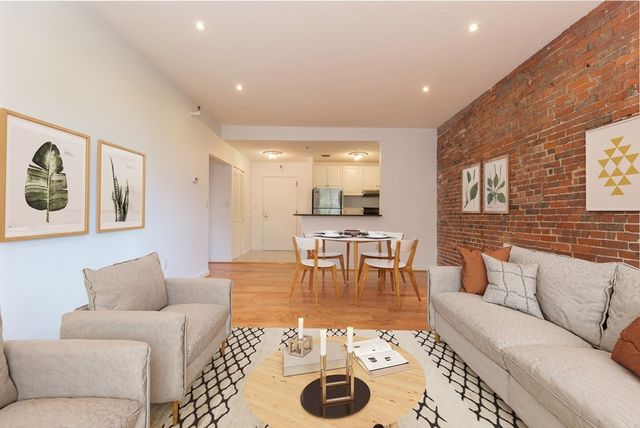 a living room with furniture and a table