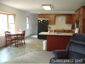 133 Grandview Lane Rutherfordton, NC 28139 - Photo 4 of 9 a kitchen with a table chairs and a refrigerator