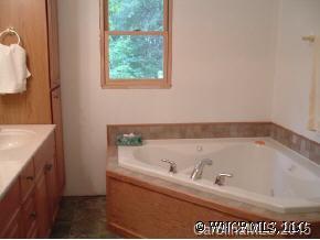 133 Grandview Lane Rutherfordton, NC 28139 - Photo 8 of 9 a bath tub sitting next to a bathroom sink