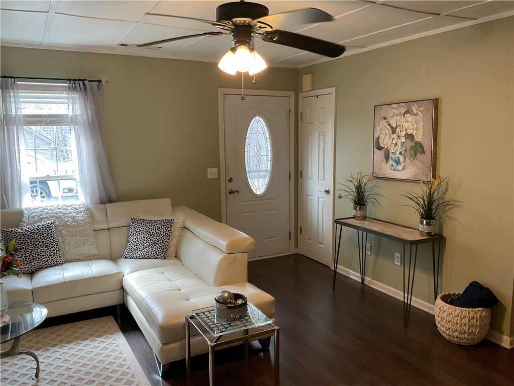 229 Cub Cove Drive Walhalla, SC 29691 - Photo 33 of 50 This inviting living space features dark hardwood flooring and a functional ceiling fan.
