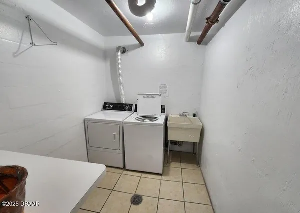 a view of a room with lots of dining hall chandelier and a rug