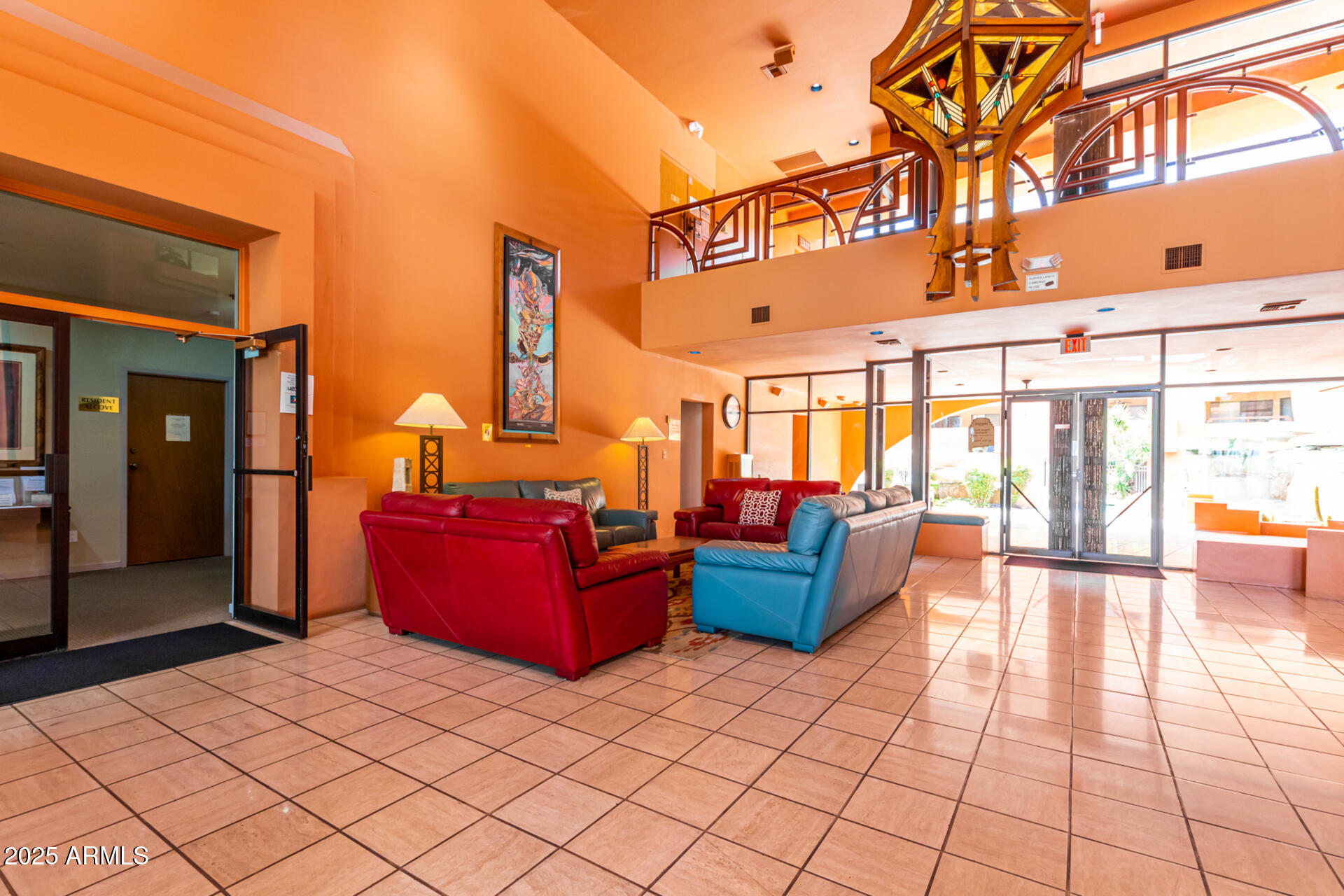 4303 East Cactus Road, Unit 202 Phoenix, AZ 85032 - Photo 20 of 34 a lobby with furniture and floor to ceiling windows