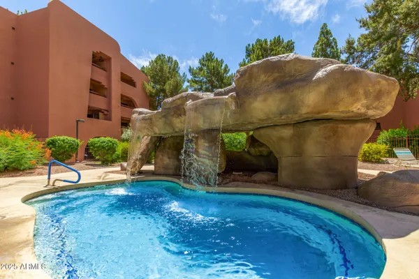a view of a swimming pool and outdoor space