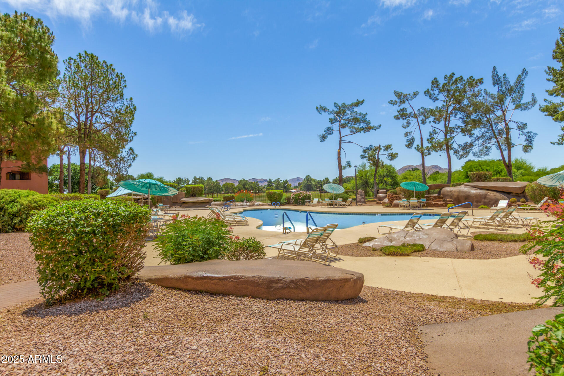 4303 East Cactus Road, Unit 202 Phoenix, AZ 85032 - Photo 28 of 34 a view of a water with palm trees