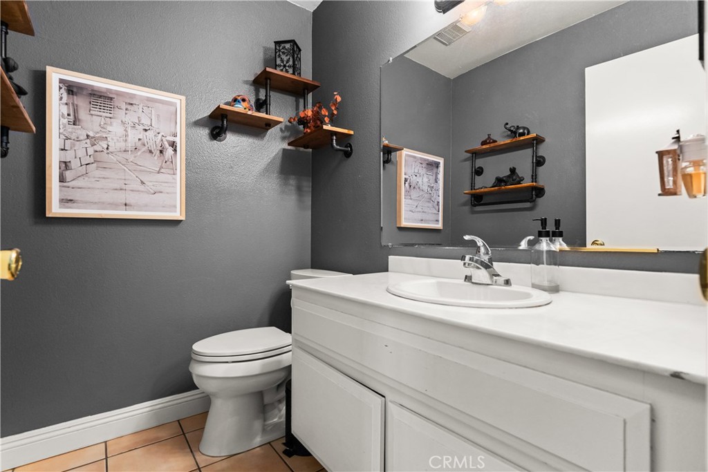 2752 Craig Circle Fullerton, CA 92835 - Photo 27 of 38 a bathroom with a toilet sink and mirror