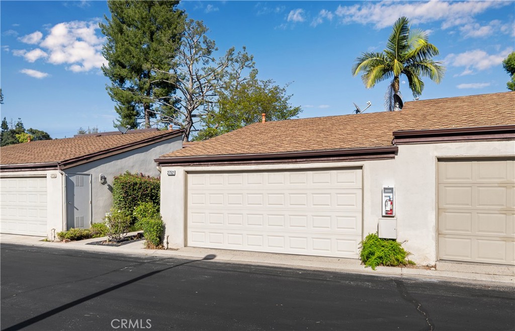 2752 Craig Circle Fullerton, CA 92835 - Photo 3 of 38 a front view of a house with a yard and garage