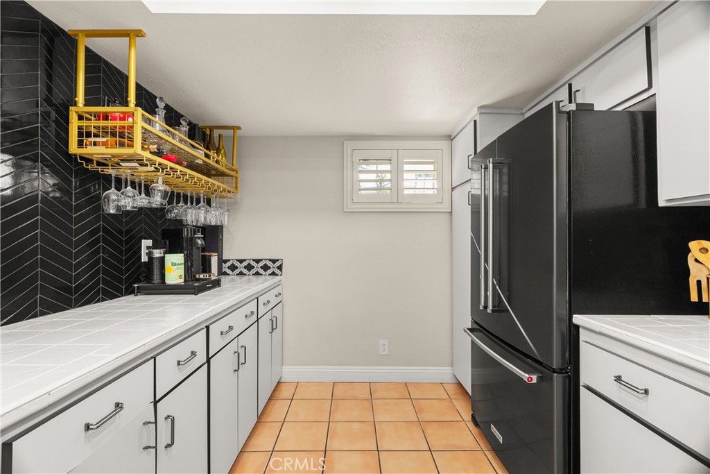 2752 Craig Circle Fullerton, CA 92835 - Photo 9 of 38 a kitchen with stainless steel appliances a refrigerator and a sink