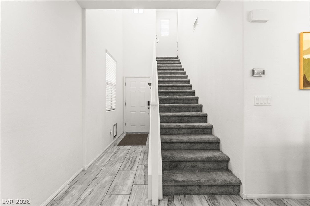 6435 Point Isabel Way Las Vegas, NV 89122 - Photo 19 of 57 Enter into a welcoming foyer with natural light and easy access to the upper level.