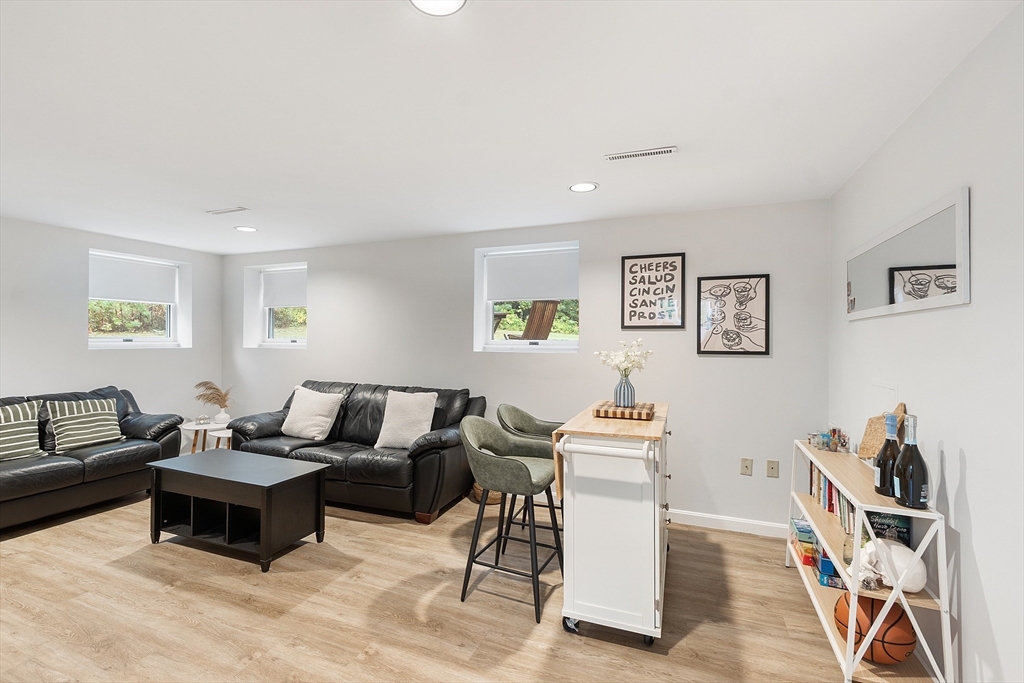 4 Long Meadow Road Chelmsford, MA 01824 - Photo 22 of 30 a living room with furniture and a wooden floor