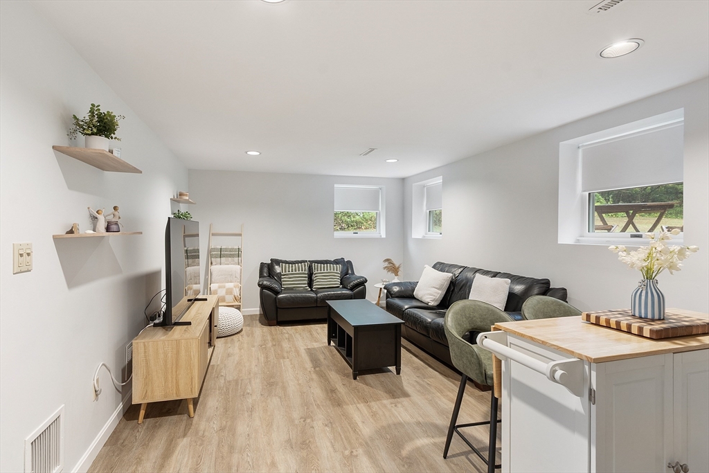 4 Long Meadow Road Chelmsford, MA 01824 - Photo 23 of 30 a living room with furniture and wooden floor