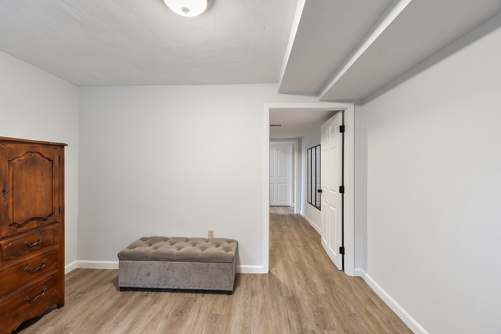 4 Long Meadow Road Chelmsford, MA 01824 - Photo 26 of 30 a living room with furniture and a wooden floor