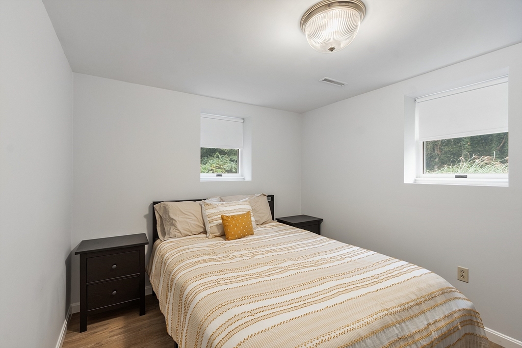 4 Long Meadow Road Chelmsford, MA 01824 - Photo 27 of 30 a bedroom with a bed and a painting on the wall