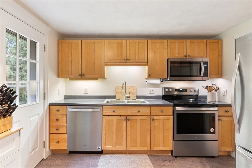 4 Long Meadow Road Chelmsford, MA 01824 - Photo 7 of 30 a kitchen with granite countertop a stove and a sink