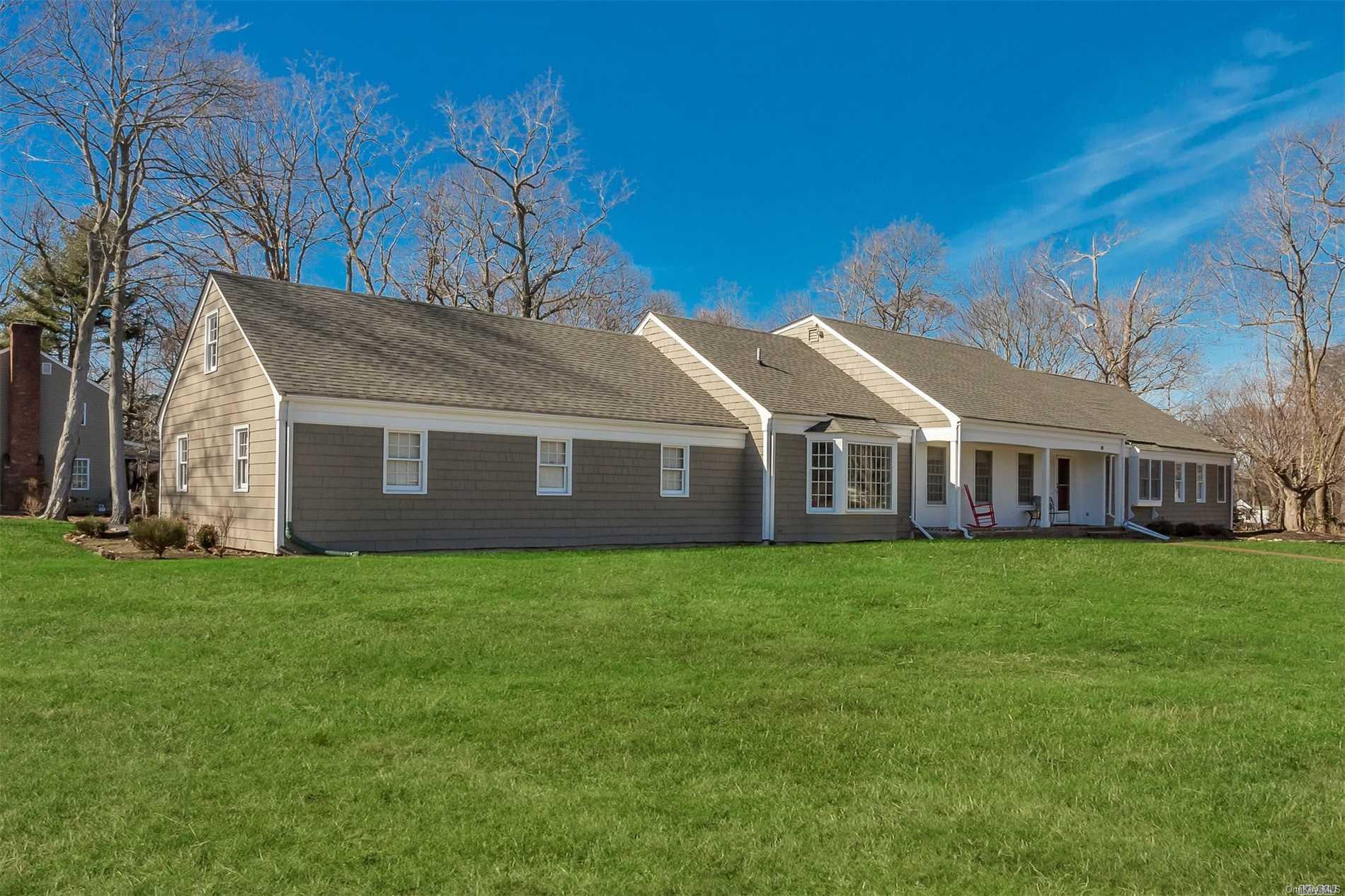 14 Little Harbor Road Mount Sinai, NY 11766 - Photo 1 of 1 a front view of a house with a garden