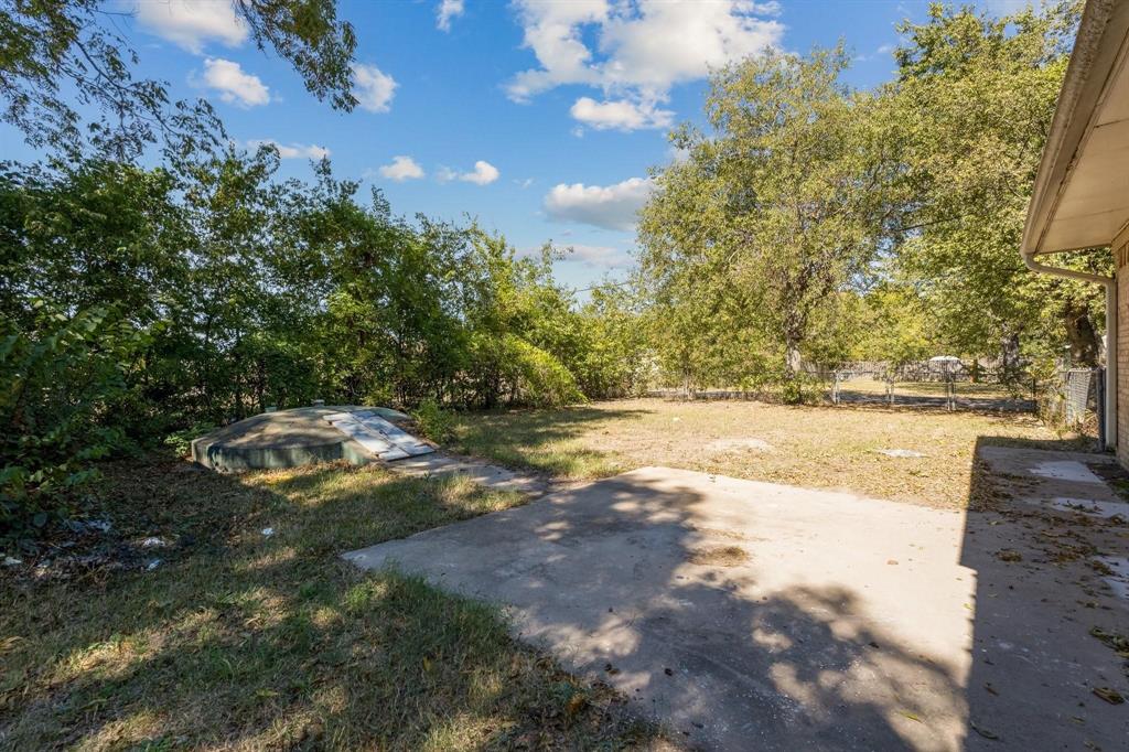 921 Evans Street Bonham, TX 75418 - Photo 28 of 28 a view of yard with green space