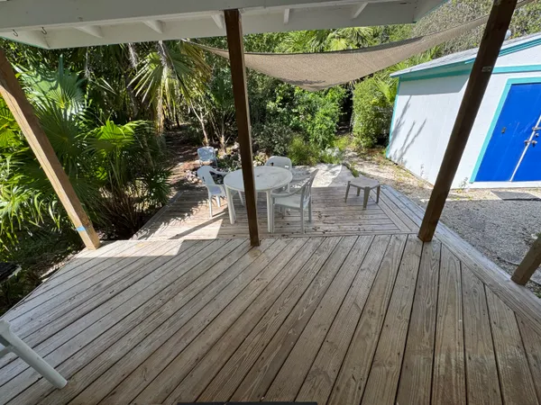 swimming pool view with a seating space