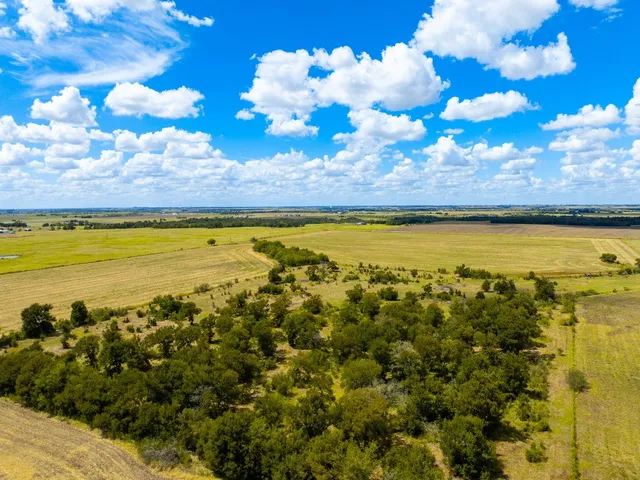 a view of a lake with a big yard