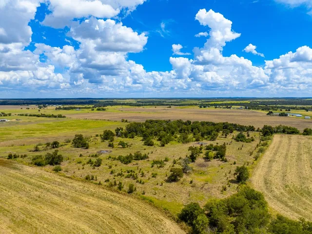 a view of a yard with swimming pool and outdoor seating