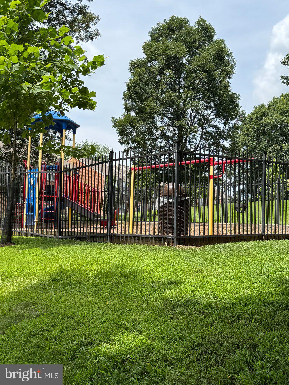 4075 Chesterwood Drive, Unit 4075 Silver Spring, MD 20906 - Photo 5 of 8 Vibrant playground in lush greenery.