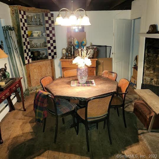 973 Danbury Road Wilton, CT 06897 - Photo 1 of 1 a view of a dining room with furniture and chandelier
