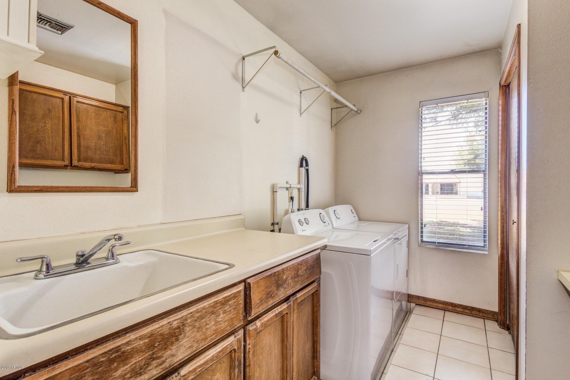 706 East Redfield Road Gilbert, AZ 85234 - Photo 33 of 44 Laundry Room with sink