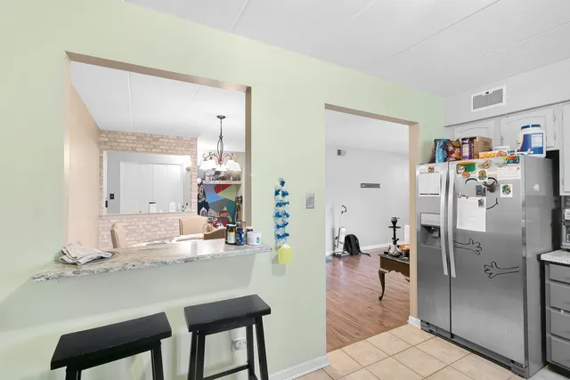 a dining hall with a dining table and chairs