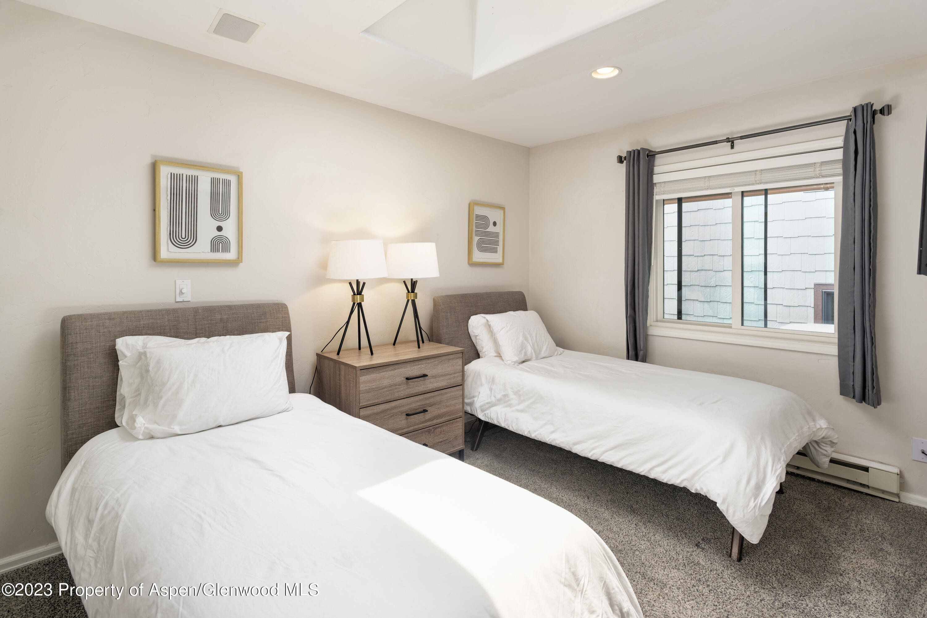 650 South Monarch Street, Unit 2 Aspen, CO 81611 - Photo 13 of 21 a bedroom with two beds and a window