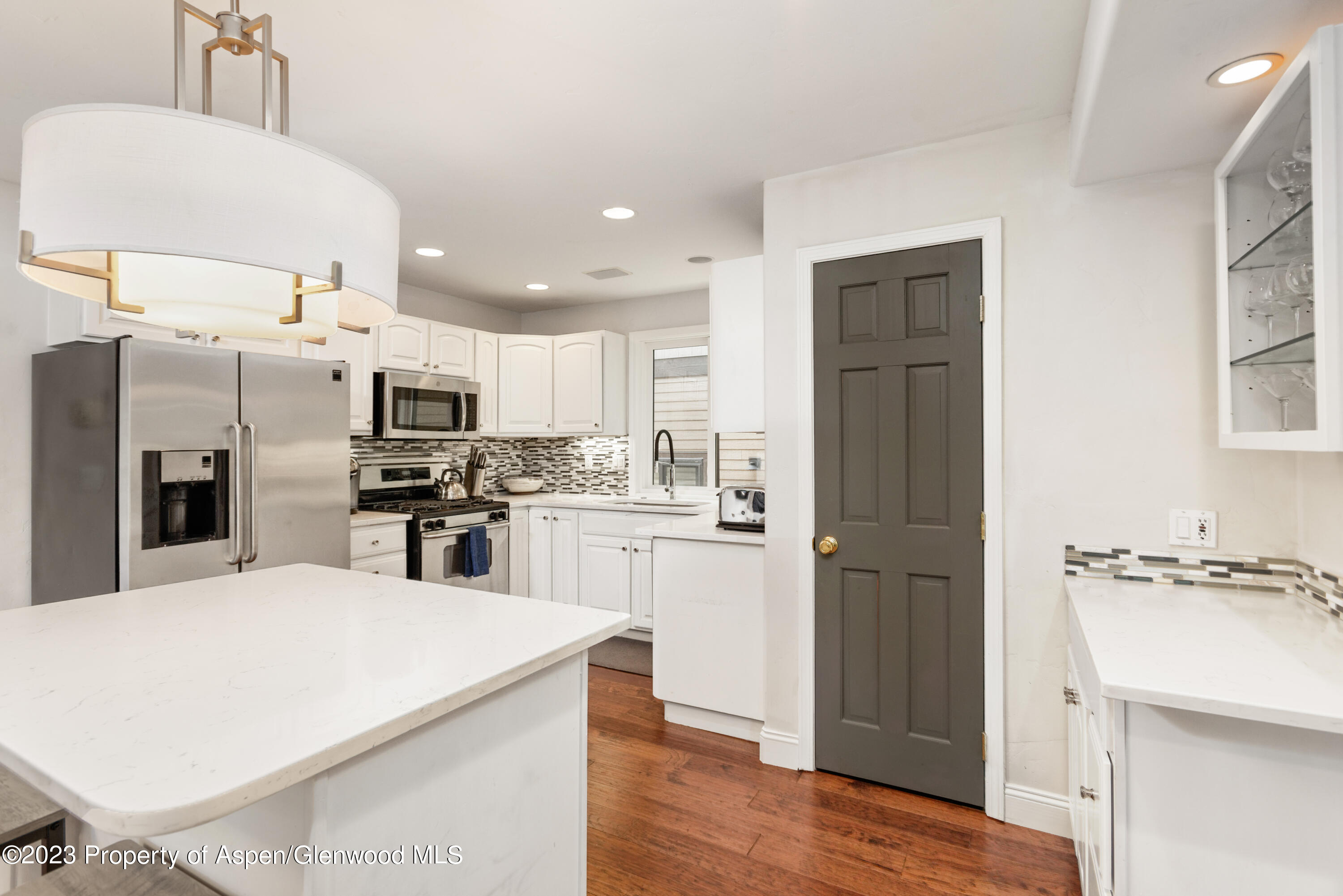 650 South Monarch Street, Unit 2 Aspen, CO 81611 - Photo 17 of 21 a kitchen with stainless steel appliances a refrigerator sink and microwave