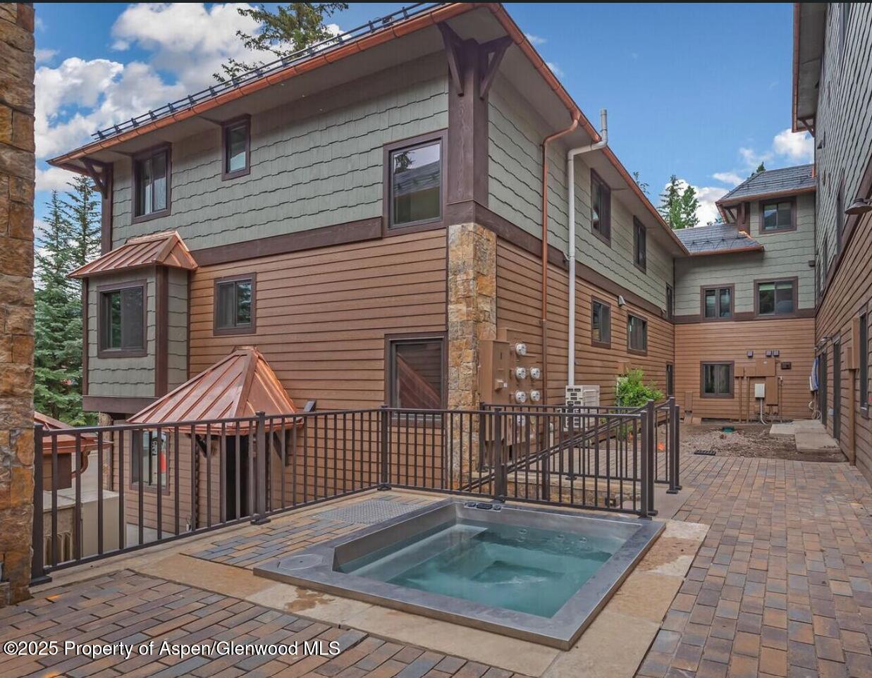 650 South Monarch Street, Unit 2 Aspen, CO 81611 - Photo 20 of 21 a view of a brick house with many windows