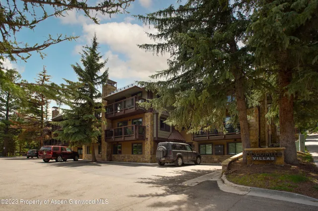 a view of a street with cars
