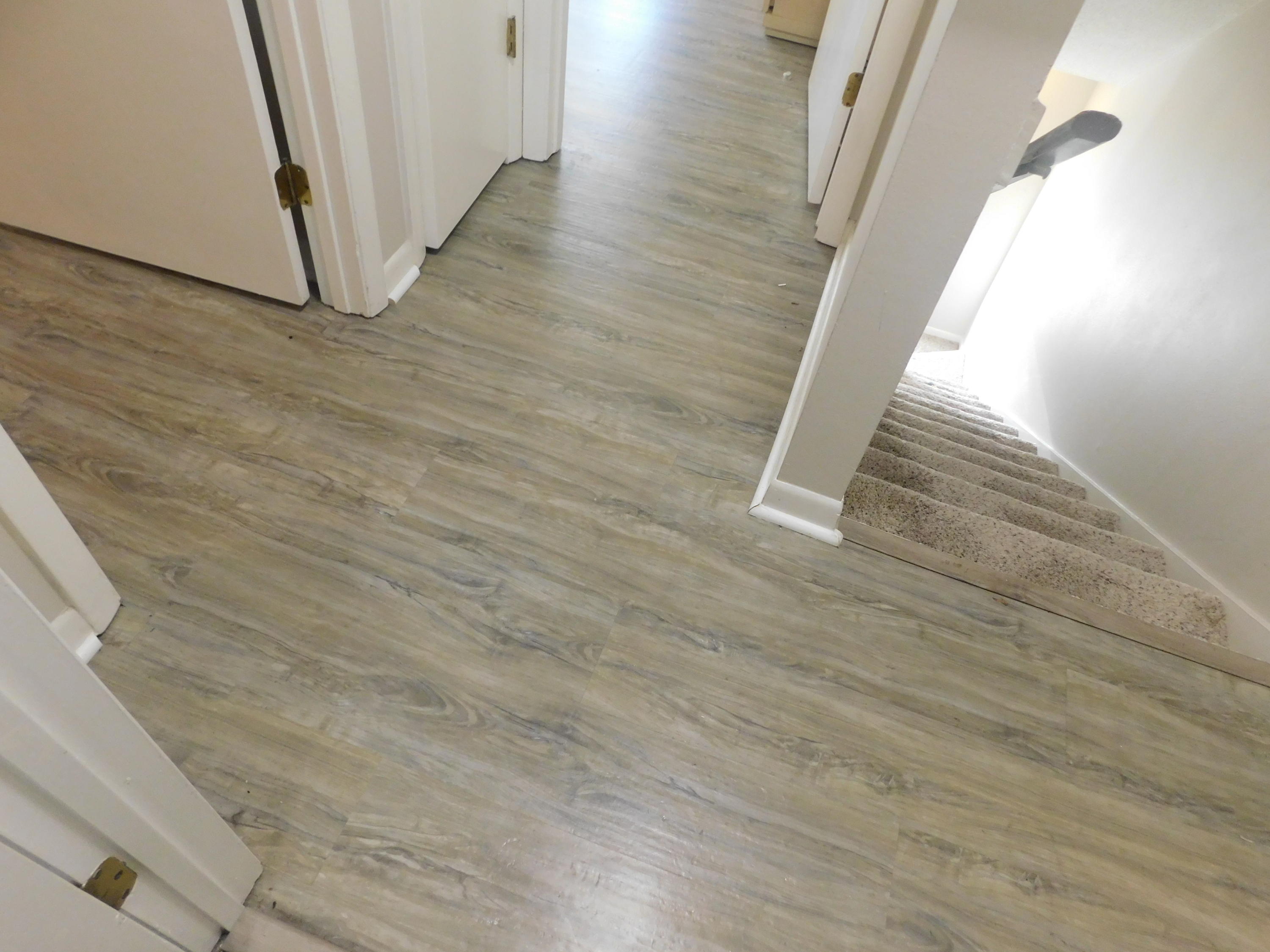 144 My Way, Unit A Santa Rosa Beach, FL 32459 - Photo 17 of 25 a view of a hallway with wooden floor