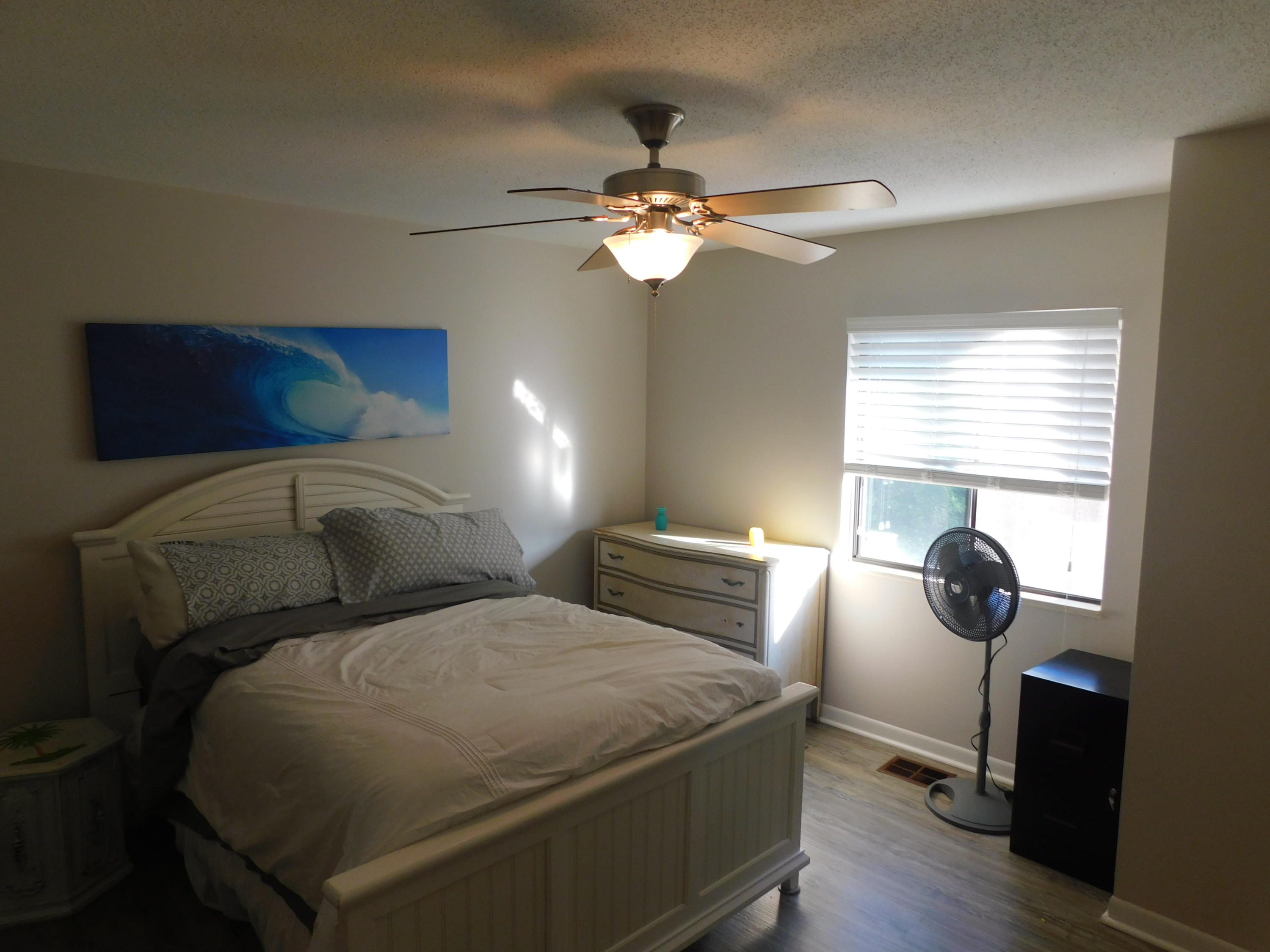 144 My Way, Unit A Santa Rosa Beach, FL 32459 - Photo 21 of 25 a bedroom with a bed and window